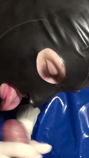 Latex Danielle in latex mask massage his toy