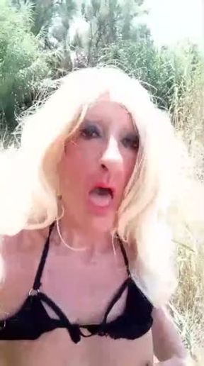 Sonya Harlot, a slut without dignity, takes off her bra and masturbates her nipples in publi