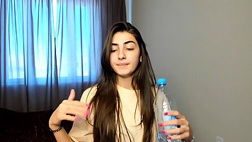 Hot, Indian brunette is wearing nothing but erotic lingerie and masturbating in front of the camera