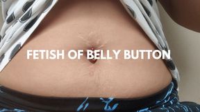 Close-up of belly button with piercing and stretch marks