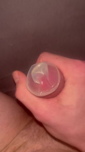 Teen jerks off with condom