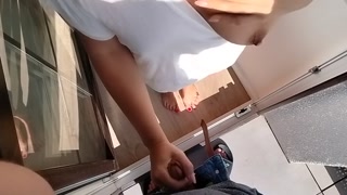 I spy on my neighbor and play with my cock.  She opens the door and starts playing with his cock too