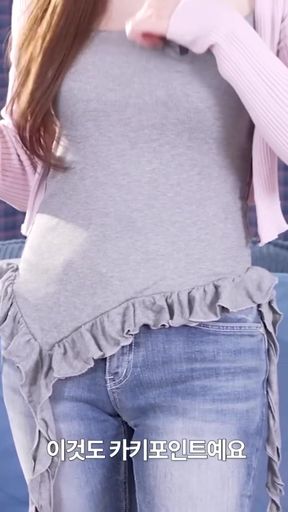 Korean woman in a grey tank top