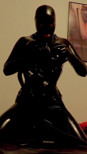 Riding the Sybian in a Black Latex Catsuit and Gas Mask