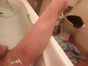 Skinny guy shows off his skinny legs in bathtub and scrubs his cock