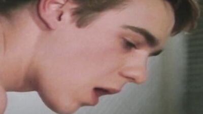 Dude bends down and takes massive cock in vintage porn scene