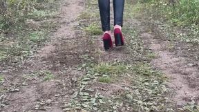 A girl in vintage heels went into the woods and got stuck in the mud with her shoes