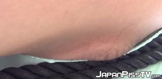 Naughty Japanese teen close up caught pissing in public