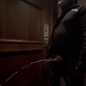 demon having a nice long piss in an elevator