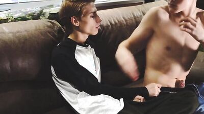 Skinny gay chap is riding his lover's hard cock on the couch