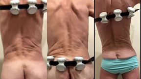 slow motion muscle roller action massage from behind nude and in light blue underwear