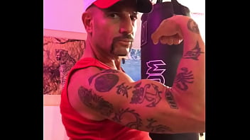 BICEP FLEXING STRONG ARM WITH TATTOOS