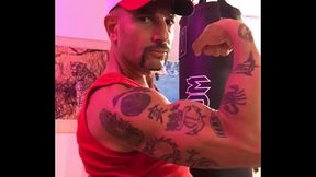 BICEP FLEXING STRONG ARM WITH TATTOOS