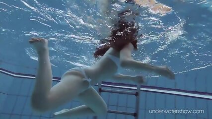 White swimsuit with tattoos babe Roxalana Cheh underwater