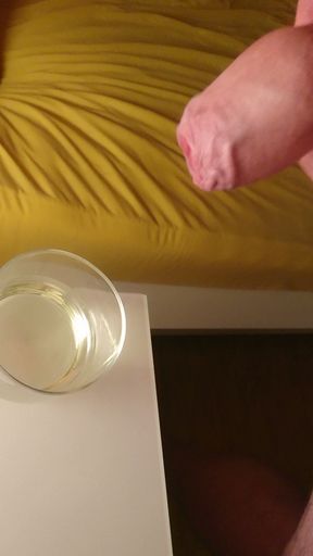 Cumming into a glass of pee