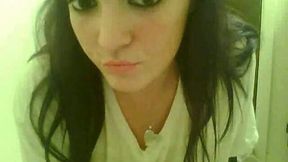 Amateur black haired webcam hoe flaunts her giant tits in white shirt
