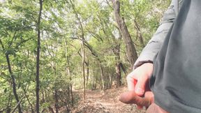 A boy with a small foreskin pees a huge stream outdoors