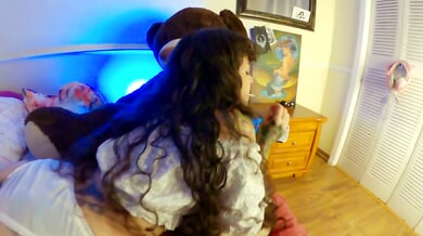 Tattooed brunette in white lingerie receives oral from green-haired man on wooden floor