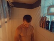 Redhead amateur edges his partially hard cock and moans for you after taking a shower