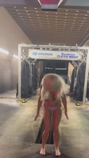 Hot Blonde gets dared to get naked in a moving car wash