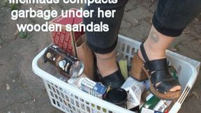 Iffelmaus compacts garbage under her wooden sandals