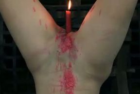 Candle wax flows through girl's pussy making her suffer