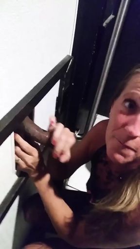 Hot MILF gives glory hole blow job while hubby jacks off