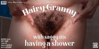 Hairy granny with saggy tits is getting wet