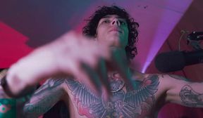 tattooed guy stroking his cock until he cums