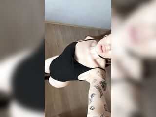 Wench in a cat suit shows her booty????