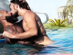 Muscle hunk pleasing big dick bareback at the poolside