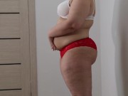 BBW shakes stuffed belly and fat ass in panties. Fetish.