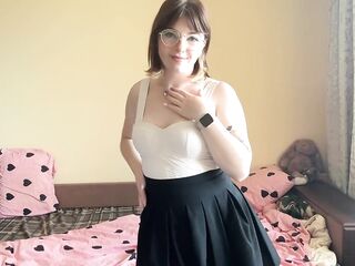 Sexy brunette squeezes her big boobs.