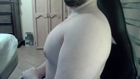 Muscular jock flexes his muscles on can