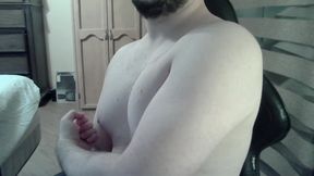 Muscular jock flexes his muscles on can