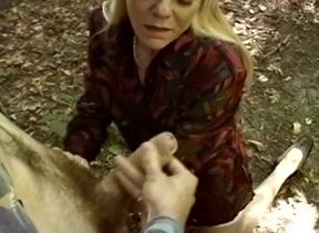 Mature beauty tugs and drains her lover's dong outdoors