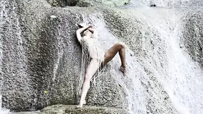Wet Monika Fox in a Fishnet at Waterfall