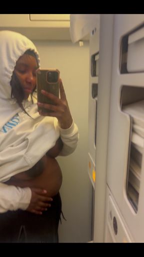 Showing my bare titties and pregnant belly