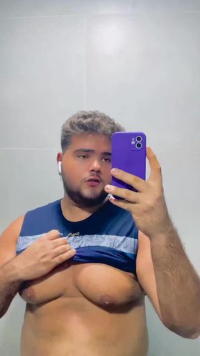 Young chubby gay showing off his nipples