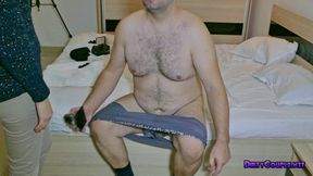 A seductive brunette is stomping on his cock and balls while wearing high heels
