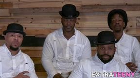 Petite teen welcomes on four black studs in a wild gang bang