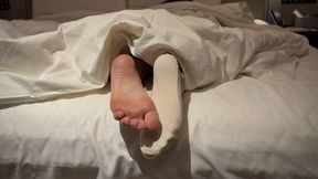 Ignoring You Listening Music - Sock Off Bare Feet Under Blanket Tease