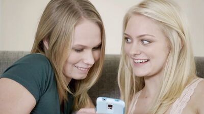 Two hot young babes share a big black cock in a threesome