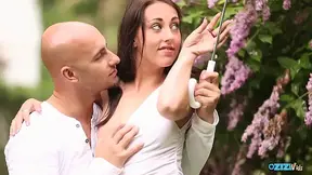 Cute couple enjoys dirty sex under a flowering tree