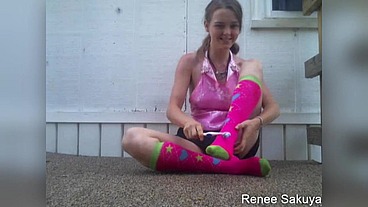 Tickling with a tooth brush outside in knee socks