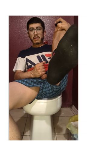 In my socks jacking off my cock with lube