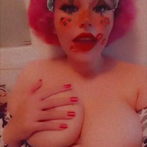 Clown girl plays with her boobs