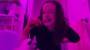 pink brushing teeth wearing burgundy nitrile gloves