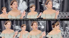 Sweet girl next door smoking in a floral dress and blowing smoke rings