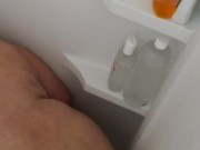 Pounding tub wall until asshole swallows huge butt plug
